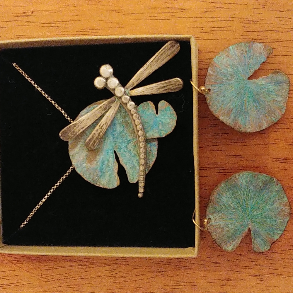 Handmade dragonfly lily pad pendant and matching lily pad earrings.